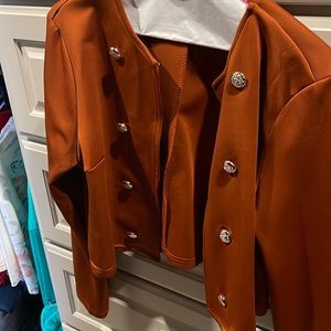 Crop jacket made of polyester and spandex. Really cute style!